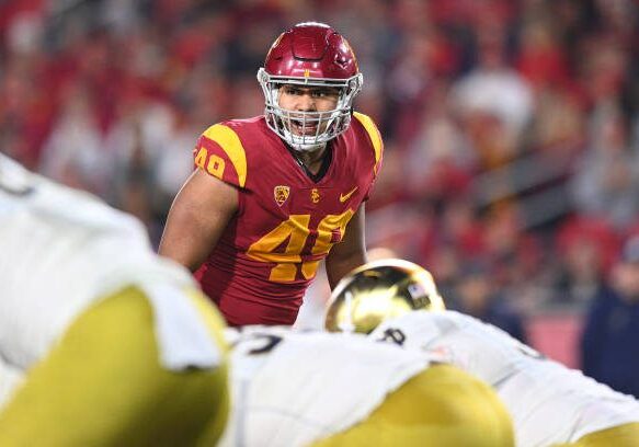 LOS ANGELES, CA - NOVEMBER 26: USC Trojans defensive lineman Tuli Tuipulotu (49) looks on during a game between the Notre Dame Fighting Irish and the USC Trojans on November 26, 2022, at Los Angeles Memorial Coliseum in Los Angeles, CA. (Photo by Brian Rothmuller/Icon Sportswire via Getty Images)