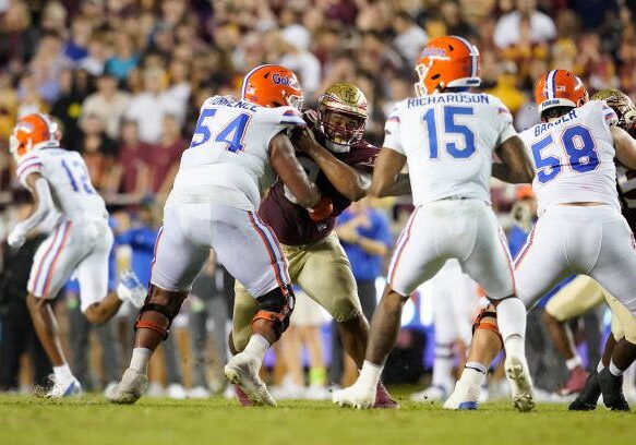 TALLAHASSEE, FL - NOVEMBER 25:Florida State Seminoles defensive tackle Fabien Lovett (0) is blocked by Florida Gators offensive lineman O'Cyrus Torrence (54)  during a college football game on Nov 25, 2022 at Doak Campbell Stadium in Tallahassee, FL. (Photo by Chris Leduc/Icon Sportswire via Getty Images)