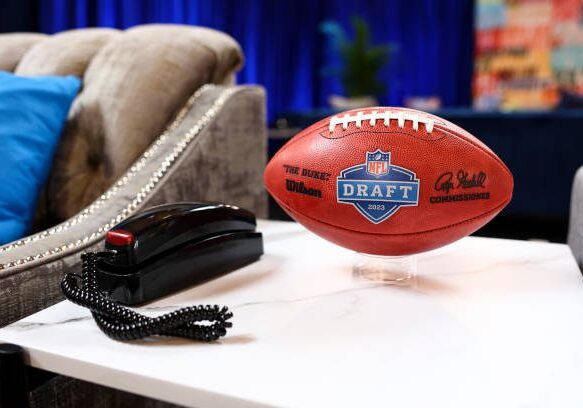 KANSAS CITY, MO - APRIL 27: A detail shot of a Wilson football next to a telephone in the green room backstage prior to the first round of the 2023 NFL Draft at Union Station on April 27, 2023 in Kansas City, Missouri. (Photo by Kevin Sabitus/Getty Images)