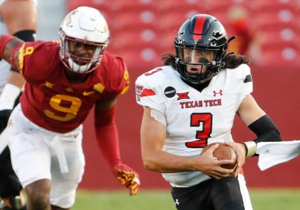 AMES, IA - OCTOBER 10: Quarterback Henry Colombi #3 of the Texas Tech Red Raiders scrambles for yards as defensive end Will McDonald IV #9 of the Iowa State Cyclones puts pressure on in the second half of the play at Jack Trice Stadium on October 10, 2020 in Ames, Iowa. The Iowa State Cyclones won 31-15 over the Texas Tech Red Raiders. (Photo by David K Purdy/Getty Images)