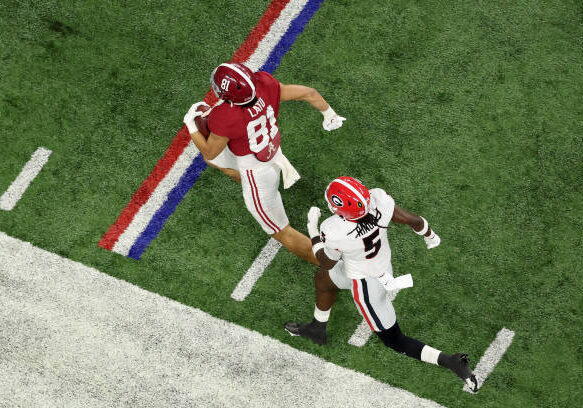 INDIANAPOLIS, INDIANA - JANUARY 10: Cameron Latu #81 of the Alabama Crimson Tide runs with the ball as Kelee Ringo #5 of the Georgia Bulldogs defends in the second quarter of the game during the 2022 CFP National Championship Game at Lucas Oil Stadium on January 10, 2022 in Indianapolis, Indiana. (Photo by Dylan Buell/Getty Images)