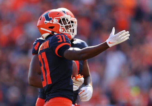CHAMPAIGN, ILLINOIS - AUGUST 27: Devon Witherspoon #31 of the Illinois Fighting Illini celebrates after intercepting a pass from Andrew Peasley #6 of the Wyoming Cowboys during the first half at Memorial Stadium on August 27, 2022 in Champaign, Illinois. (Photo by Michael Reaves/Getty Images)