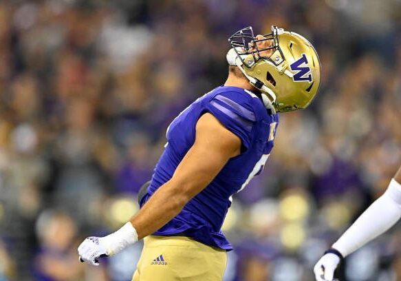 SEATTLE, WASHINGTON - SEPTEMBER 24: Bralen Trice #8 of the Washington Huskies celebrates after sacking Tanner McKee #18 of the Stanford Cardinal during the first quarter of the game at Husky Stadium on September 24, 2022 in Seattle, Washington. (Photo by Alika Jenner/Getty Images)