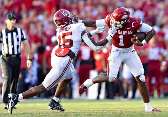 FAYETTEVILLE, ARKANSAS - OCTOBER 1: K.J. Jefferson #1 of the Arkansas Razorbacks is tackled by Dallas Turner #15 of the Alabama Crimson Tide at Donald W. Reynolds Razorback Stadium on October 1, 2022 in Fayetteville, Arkansas. The Crimson Tide defeated the Razorbacks 49-26. (Photo by Wesley Hitt/Getty Images)