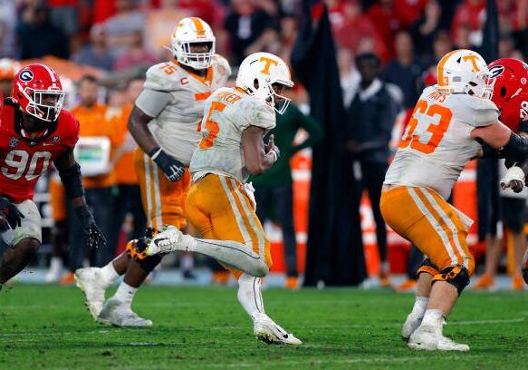 ATHENS, GEORGIA - NOVEMBER 05: Hendon Hooker #5 of the Tennessee Volunteers scrambles during the fourth quarter against the Georgia Bulldogs at Sanford Stadium on November 05, 2022 in Athens, Georgia. (Photo by Todd Kirkland/Getty Images)