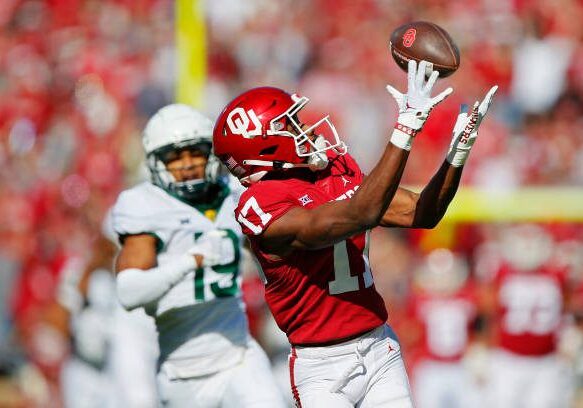 NORMAN, OK - NOVEMBER 5: Wide receiver Marvin Mims Jr. #17 of the Oklahoma Sooners pulls down a 63-yard catch for a touchdown against cornerback AJ McCarty #19 of the Baylor Bears in the first quarter at Gaylord Family Oklahoma Memorial Stadium on November 5, 2022 in Norman, Oklahoma.  (Photo by Brian Bahr/Getty Images)