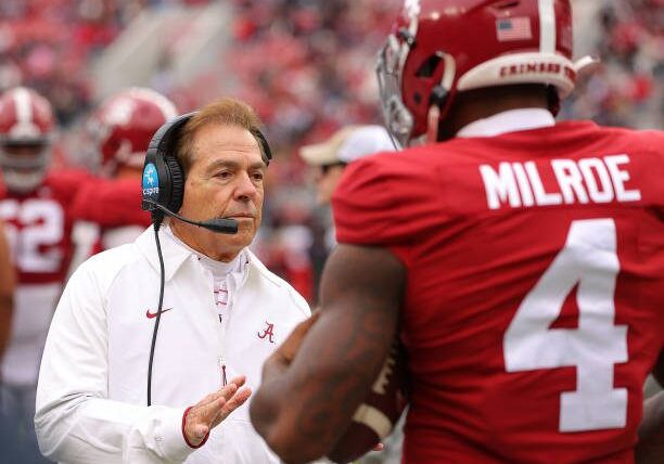 TUSCALOOSA, ALABAMA - NOVEMBER 19:  Head coach Nick Saban of the Alabama Crimson Tide communicates to Jalen Milroe #4 against the Austin Peay Governors during the fourth quarter at Bryant-Denny Stadium on November 19, 2022 in Tuscaloosa, Alabama. (Photo by Kevin C. Cox/Getty Images)