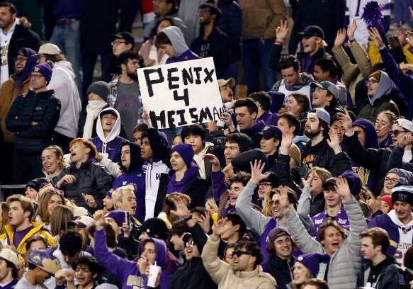 SEATTLE, WASHINGTON - NOVEMBER 19: Fans cheer for Michael Penix Jr. #9 of the Washington Huskies during the third quarter against the Colorado Buffaloes at Husky Stadium on November 19, 2022 in Seattle, Washington. (Photo by Steph Chambers/Getty Images)