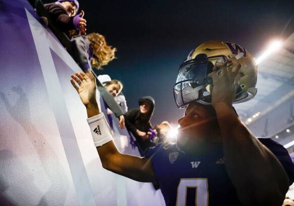 SEATTLE, WASHINGTON - NOVEMBER 19: Michael Penix Jr. #9 of the Washington Huskies reacts after beating Colorado Buffaloes 54-7 at Husky Stadium on November 19, 2022 in Seattle, Washington. (Photo by Steph Chambers/Getty Images)