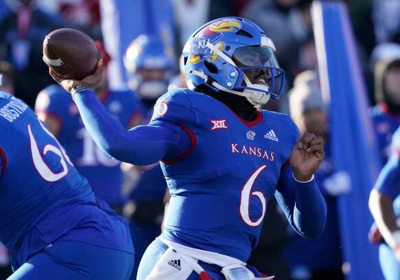 LAWRENCE, KANSAS - NOVEMBER 19: Quarterback Jalon Daniels #6 of the Kansas Jayhawks passes in the first half against the Texas Longhorns at David Booth Kansas Memorial Stadium on November 19, 2022 in Lawrence, Kansas. (Photo by Ed Zurga/Getty Images)