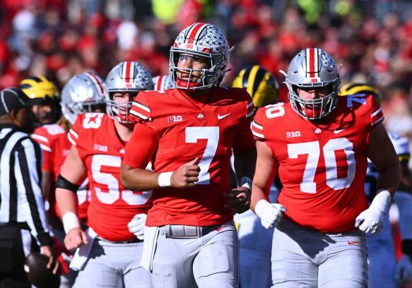COLUMBUS, OHIO - NOVEMBER 26: C.J. Stroud #7 of the Ohio State Buckeyes runs off the field at the end the second quarter of a game against the Michigan Wolverines at Ohio Stadium on November 26, 2022 in Columbus, Ohio. (Photo by Ben Jackson/Getty Images)