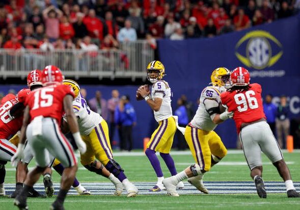 ATLANTA, GEORGIA - DECEMBER 03: Jayden Daniels #5 of the LSU Tigers looks to pass against the Georgia Bulldogs during the first quarter in the SEC Championship game at Mercedes-Benz Stadium on December 03, 2022 in Atlanta, Georgia. (Photo by Kevin C. Cox/Getty Images)