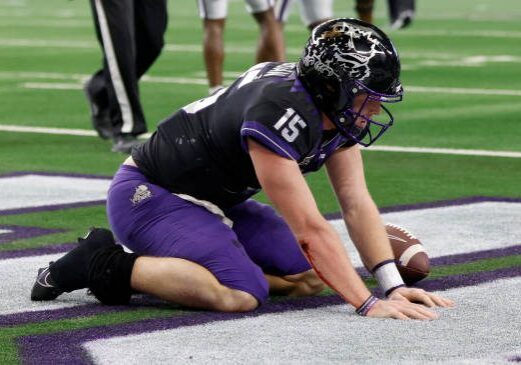 ARLINGTON, TX - DECEMBER 3: Max Duggan #15 of the TCU Horned Frogs stays down after running for a touchdown against the Kansas State Wildcats in the second half of the Big 12 Football Championship at AT&amp;T Stadium on December 3, 2022 in Arlington, Texas. Kansas State won 31-28 in overtime. (Photo by Ron Jenkins/Getty Images)