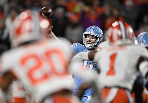 CHARLOTTE, NORTH CAROLINA - DECEMBER 03: Drake Maye #10 of the North Carolina Tar Heels throws a pass against the Clemson Tigers in the second quarter during the ACC Championship game at Bank of America Stadium on December 03, 2022 in Charlotte, North Carolina. (Photo by Eakin Howard/Getty Images)
