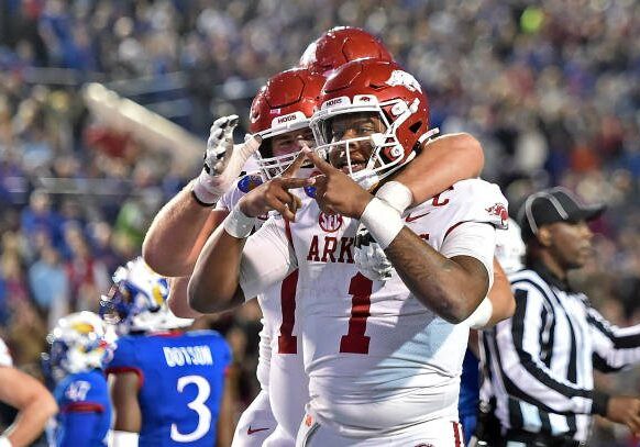 MEMPHIS, TENNESSEE - DECEMBER 28: KJ Jefferson #1 of the Arkansas Razorbacks reacts after scoring a touchdown during the first half of the Autozone Liberty Bowl game against the Kansas Jayhawks at Simmons Bank Liberty Stadium on December 28, 2022 in Memphis, Tennessee. (Photo by Justin Ford/Getty Images)