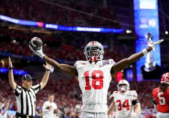 ATLANTA, GEORGIA - DECEMBER 31: Marvin Harrison Jr. #18 of the Ohio State Buckeyes celebrates after a touchdown during the second quarter in the Chick-fil-A Peach Bowl at Mercedes-Benz Stadium on December 31, 2022 in Atlanta, Georgia. (Photo by Carmen Mandato/Getty Images)