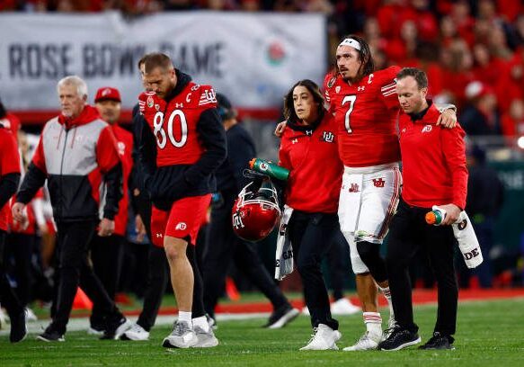 PASADENA, CALIFORNIA - JANUARY 02: Cameron Rising #7 of the Utah Utes is assisted off the field after being injured in a play against the Penn State Nittany Lions during the third quarter in the 2023 Rose Bowl Game at Rose Bowl Stadium on January 02, 2023 in Pasadena, California. (Photo by Ronald Martinez/Getty Images)