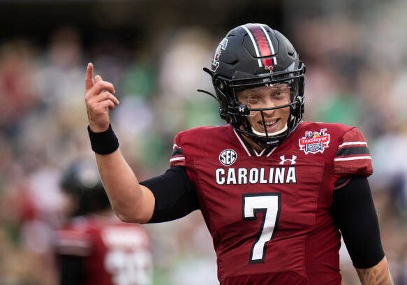 JACKSONVILLE, FLORIDA - DECEMBER 30: Spencer Rattler #7 of the South Carolina Gamecocks celebrates after scoring a touchdown against the Notre Dame Fighting Irish during the first half of the TaxSlayer Gator Bowl at TIAA Bank Field on December 30, 2022 in Jacksonville, Florida. (Photo by James Gilbert/Getty Images)