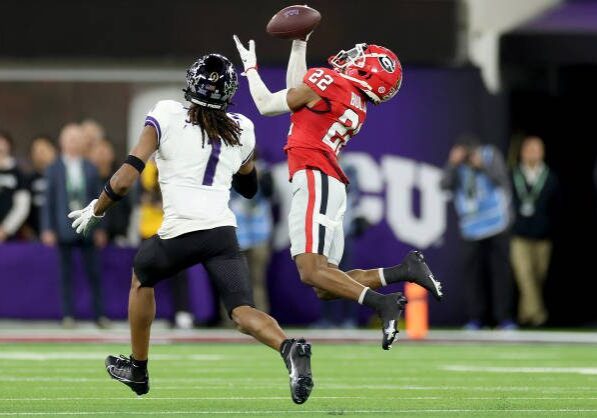 INGLEWOOD, CALIFORNIA - JANUARY 09: Javon Bullard #22 of the Georgia Bulldogs intercepts a pass intended for Quentin Johnston #1 of the TCU Horned Frogs in the second quarter in the College Football Playoff National Championship game at SoFi Stadium on January 09, 2023 in Inglewood, California. (Photo by Ezra Shaw/Getty Images)