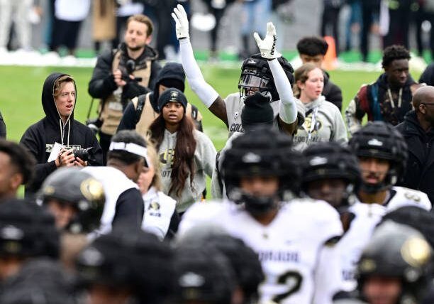 BOULDER, CO - APRIL 22: Colorado Buffaloes CB/WR Travis Hunter waves to the fans while coming off the field after warmups for the Black and Gold game at Folsom Field April 22, 2023. (Photo by Andy Cross/MediaNews Group/The Denver Post via Getty Images)