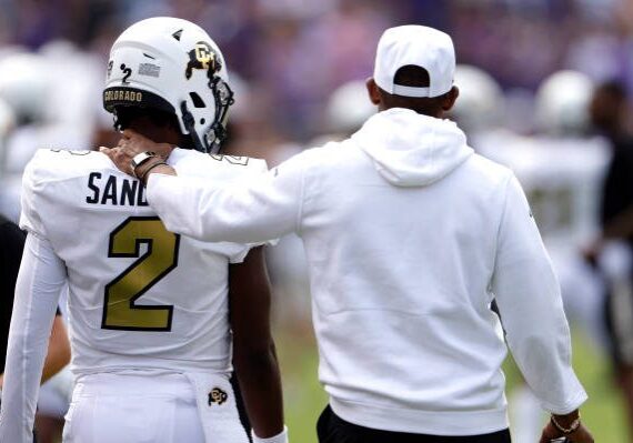 FORT WORTH, TX - SEPTEMBER 2: Shedeur Sanders #2 of the Colorado Buffaloes and his father and head coach Deion Sanders walk the sidelines just before the game against the TCU Horned Frogs at Amon G. Carter Stadium on September 2, 2023 in Fort Worth, Texas. Colorado won 45-42. (Photo by Ron Jenkins/Getty Images)