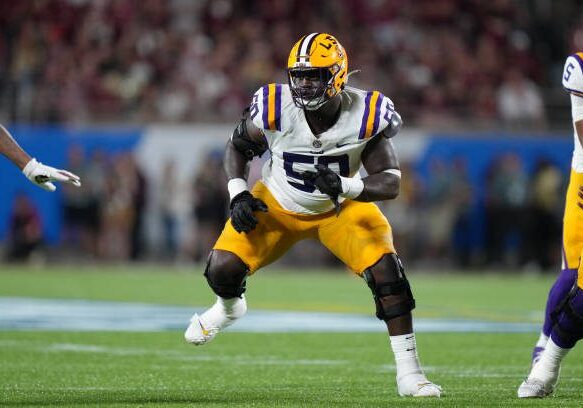 ORLANDO, FL - SEPTEMBER 03: LSU Tigers offensive lineman Emery Jones Jr. (50) looks to block an incoming defensive lineman during the Camping World Kickoff game between the LSU Tigers and the Florida State Seminoles, on Sunday, September 3, 2023 at Camping World Stadium in Orlando, Fla. (Photo by Peter Joneleit/Icon Sportswire via Getty Images)