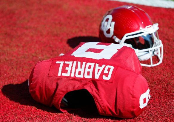 NORMAN, OKLAHOMA - SEPTEMBER 2:  Oklahoma Sooners quarterback Dillon Gabriel's jersey and helmet sit in the end zone before a game against the Arkansas State Red Wolves at Gaylord Family Oklahoma Memorial Stadium on September 2, 2023 in Norman, Oklahoma.  Oklahoma won 73-0. (Photo by Brian Bahr/Getty Images)