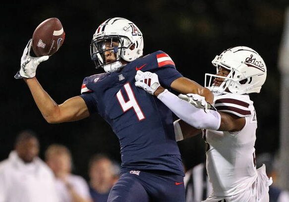 STARKVILLE, MISSISSIPPI - SEPTEMBER 09: Tetairoa McMillan #4 of the Arizona Wildcats catches a pass against Decamerion Richardson #3 of the Mississippi State Bulldogs during the second half at Davis Wade Stadium on September 09, 2023 in Starkville, Mississippi. (Photo by Justin Ford/Getty Images)