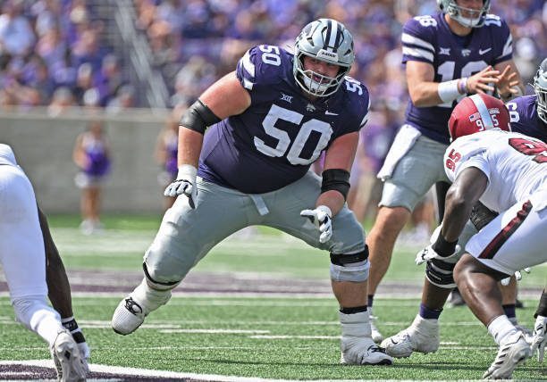 MANHATTAN, KS - SEPTEMBER 09:  Offensive lineman Cooper Beebe #50 of the Kansas State Wildcats gets set on the line during a play against the Troy Trojans in the first half at Bill Snyder Family Football Stadium on September 09, 2023 in Manhattan, Kansas. (Photo by Peter G. Aiken/Getty Images)