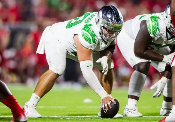 LUBBOCK, TEXAS - SEPTEMBER 09: Jackson Powers-Johnson #58 of the Oregon Ducks lines up over the ball during the second half of the game against the Texas Tech Red Raiders at Jones AT&amp;T Stadium on September 09, 2023 in Lubbock, Texas. (Photo by John E. Moore III/Getty Images)