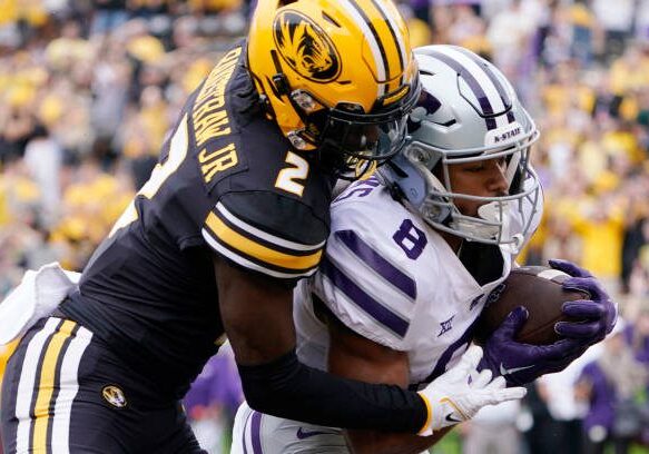 COLUMBIA, MISSOURI - SEPTEMBER 16: ide receiver Phillip Brooks #8 of the Kansas State Wildcats catches a touchdown pass against defensive back Ennis Rakestraw Jr. #2 of the Missouri Tigers in the first half at Faurot Field/Memorial Stadium on September 16, 2023 in Columbia, Missouri. (Photo by Ed Zurga/Getty Images)