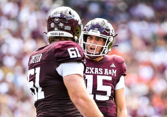 COLLEGE STATION, TEXAS - SEPTEMBER 23: Quarterback Conner Weigman #15 yells at offensive lineman Bryce Foster #61 of the Texas A&amp;M Aggies during the first half against the Auburn Tigers at Kyle Field on September 23, 2023 in College Station, Texas. (Photo by Logan Riely/Getty Images)