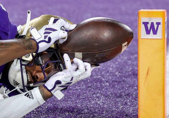 SEATTLE, WASHINGTON - SEPTEMBER 23: Ja'Lynn Polk #2 of the Washington Huskies catches a touchdown pass during the first quarter against the California Golden Bears at Husky Stadium on September 23, 2023 in Seattle, Washington. (Photo by Steph Chambers/Getty Images)