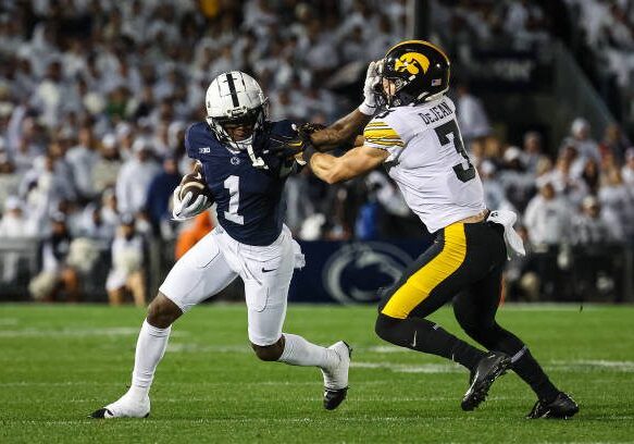 STATE COLLEGE, PA - SEPTEMBER 23: KeAndre Lambert-Smith #1 of the Penn State Nittany Lions carries the ball as Cooper DeJean #3 of the Iowa Hawkeyes defends during the first half at Beaver Stadium on September 23, 2023 in State College, Pennsylvania. (Photo by Scott Taetsch/Getty Images)