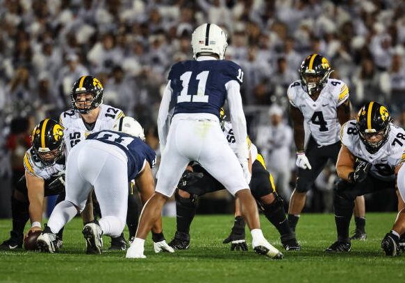 STATE COLLEGE, PA - SEPTEMBER 23: Cade McNamara #12 of the Iowa Hawkeyes leads the offense at the line of scrimmage against the Penn State Nittany Lions during the first half at Beaver Stadium on September 23, 2023 in State College, Pennsylvania. (Photo by Scott Taetsch/Getty Images)
