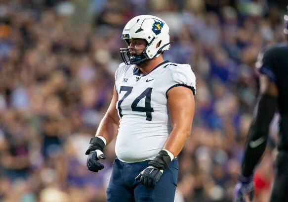 FORT WORTH, TX - SEPTEMBER 30: West Virginia Mountaineers offensive lineman Wyatt Milum (74) looks to the defense between plays during a college football game between West Virginia Mountaineers and TCU Horned Frogs on Sept 30, 2023, at Amon G Cater Stadium in Fort Worth, TX.(Photo by Christopher Leduc/Icon Sportswire via Getty Images)