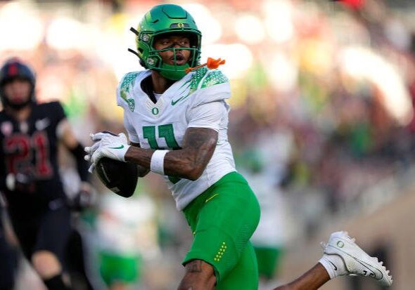 STANFORD, CALIFORNIA - SEPTEMBER 30: Troy Franklin #11 of the Oregon Ducks scores on a 46-yard pass play against the Stanford Cardinal in the third quarter of an NCAA football game at Stanford Stadium on September 30, 2023 in Stanford, California. (Photo by Thearon W. Henderson/Getty Images)