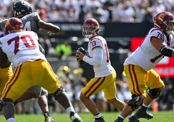 BOULDER, CO - SEPTEMBER 30:  Quarterback Caleb Williams #13 of the USC Trojans looks for a target against the Colorado Buffaloes in the fourth quarter against the Colorado Buffaloes at Folsom Field on September 30, 2023 in Boulder, Colorado. (Photo by Dustin Bradford/Getty Images)