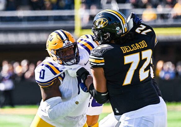 COLUMBIA, MO - OCTOBER 07: LSU Tigers defensive tackle Maason Smith (0) battles at the line with Missouri Tigers offensive lineman Xavier Delgado (72) during a SEC conference game between the Louisiana State  Tigers and the Missouri Tigers held on Saturday Oct 07, 2023 at Faurot Field at Memorial Stadium in Columbia MO. (Photo by Rick Ulreich/Icon Sportswire via Getty Images