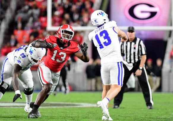 ATHENS, GA - OCTOBER 7: Bulldog defender Mykel Williams #13 rushes Wildcat quarterback Devin Leary #13 during a game between University of Kentucky and University of Georgia at Sanford Stadium on October 7, 2023 in Athens, Georgia. (Photo by Perry McIntyre/ISI Photos/Getty Images)