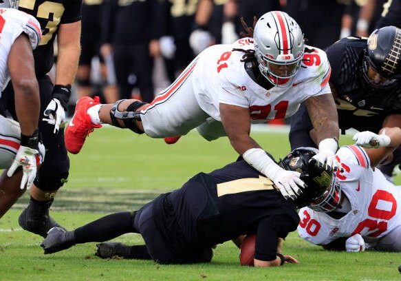 WEST LAFAYETTE, INDIANA - OCTOBER 14: Tyleik Williams #91 of the Ohio State Buckeyes tackles Hudson Card #1 of the Purdue Boilermakers at Ross-Ade Stadium on October 14, 2023 in West Lafayette, Indiana. (Photo by Justin Casterline/Getty Images)