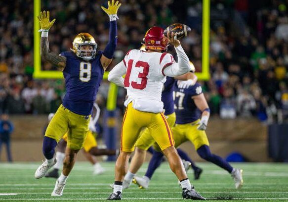 SOUTH BEND, IN - OCTOBER 14: Marist Liufau #8 of Notre Dame pressures Caleb Williams #13 of USC during a game between University of Southern California and University of Notre Dame at Notre Dame Stadium on October 14, 2023 in South Bend, Indiana. (Photo by Michael Miller/ISI Photos/Getty Images)