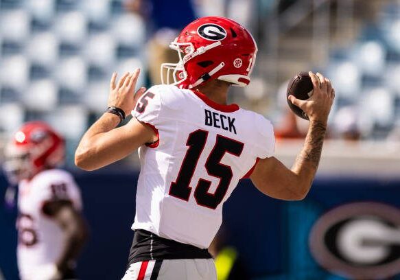 JACKSONVILLE, FLORIDA - OCTOBER 28: Carson Beck #15 of the Georgia Bulldogs warms up before the start of a game against the Florida Gators at EverBank Stadium on October 28, 2023 in Jacksonville, Florida. (Photo by James Gilbert/Getty Images)