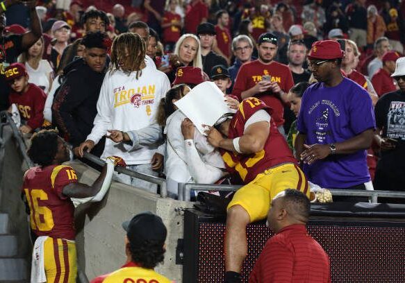 LOS ANGELES, CA - NOVEMBER 04: USC Trojans quarterback Caleb Williams (13) shares a moment with his family after being defeated by the Washington Huskies on November 04, 2023, at the Los Angeles Memorial Coliseum in Los Angeles, CA.(Photo by Jevone Moore/Icon Sportswire via Getty Images)