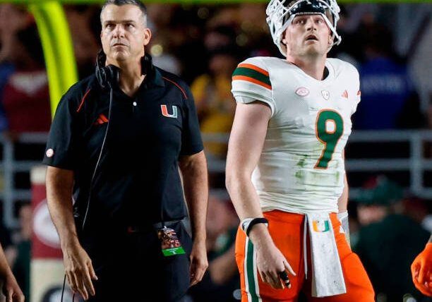 Miami Hurricanes head coach Mario Cristobal and quarterback Tyler Van Dyke (9) wait for the call by the officials in the final seconds of the game against the Florida State Seminoles at Doak Campbell Stadium in Tallahassee on Saturday, Nov. 11, 2023. (Al Diaz/Miami Herald/Tribune News Service via Getty Images)