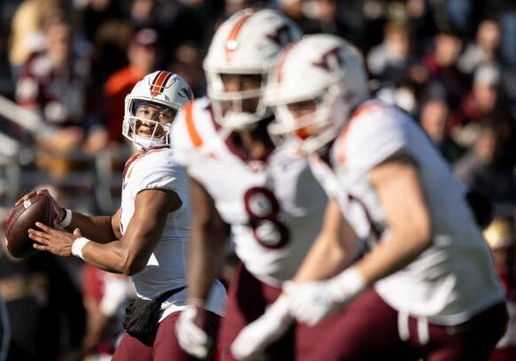 CHESTNUT HILL, MASSACHUSETTS - NOVEMBER 11: Kyron Drones #1 of the Virginia Tech Hokies makes a pass during a game against the Boston College Eagles at Alumni Stadium on November 11, 2023 in Chestnut Hill, Massachusetts. (Photo by Maddie Malhotra/Getty Images)