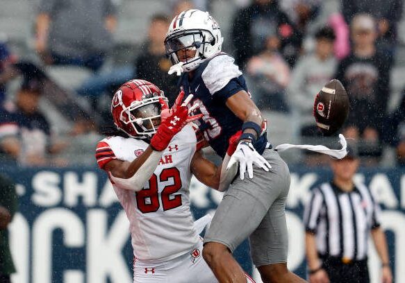 TUCSON, ARIZONA - NOVEMBER 18: Cornerback Tacario Davis #23 of the Arizona Wildcats breaks up a pass intended for tight end Landen King #82 of the Utah Utes during the first half at Arizona Stadium on November 18, 2023 in Tucson, Arizona. (Photo by Chris Coduto/Getty Images)