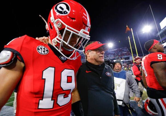 ATLANTA, GEORGIA - NOVEMBER 25: Head coach Kirby Smart leaves the field with Brock Bowers #19 of the Georgia Bulldogs following the 31-23 victory over the Georgia Tech Yellow Jackets at Bobby Dodd Stadium on November 25, 2023 in Atlanta, Georgia. (Photo by Todd Kirkland/Getty Images)