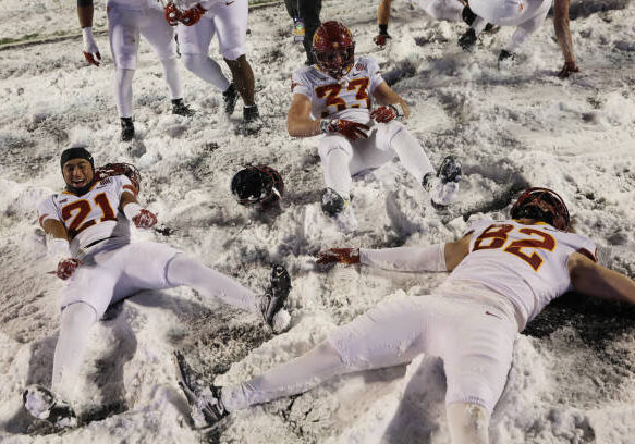 MANHATTAN, KS - NOVEMBER 25: Iowa State Cyclones players celebrate in the snow after a Big 12 football game between the Iowa State Cyclones and Kansas State Wildcats on Nov 25, 2023 at Bill Snyder Family Stadium in Manhattan, KS. (Photo by Scott Winters/Icon Sportswire via Getty Images)