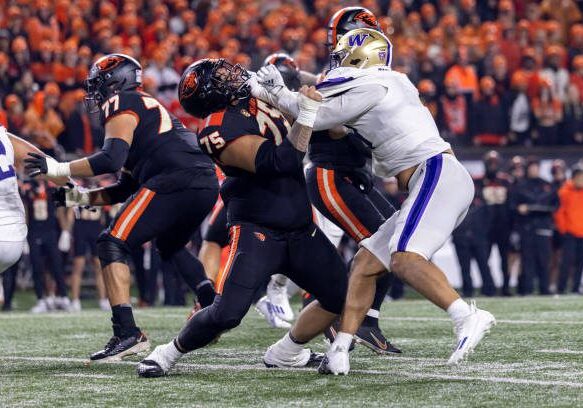 CORVALLIS, OREGON - NOVEMBER 18: Offensive lineman Taliese Fuaga #75 of the Oregon State Beavers blocks defensive end Bralen Trice #8 of the Washington Huskies at Reser Stadium on November 18, 2023 in Corvallis, Oregon. (Photo by Tom Hauck/Getty Images)
